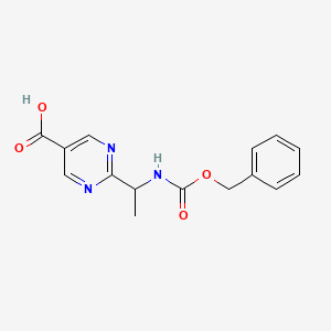 molecular formula C15H15N3O4 B13181846 2-(1-{[(Benzyloxy)carbonyl]amino}ethyl)pyrimidine-5-carboxylic acid 