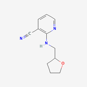 B1318353 2-[(Tetrahydrofuran-2-ylmethyl)amino]-nicotinonitrile CAS No. 945298-35-1