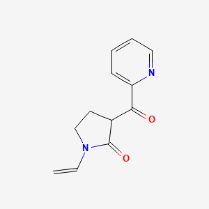 molecular formula C12H12N2O2 B1318512 3-(Pyridin-2-ylcarbonyl)-1-vinylpyrrolidin-2-one 