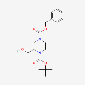 molecular formula C18H26N2O5 B1319073 4-苄基-1-叔丁基-2-(羟甲基)哌嗪-1,4-二羧酸酯 CAS No. 557056-07-2