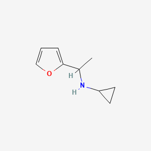 molecular formula C9H13NO B13202481 N-[1-(furan-2-yl)ethyl]cyclopropanamine 