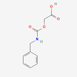molecular formula C10H11NO4 B13203542 2-[(Benzylcarbamoyl)oxy]acetic acid CAS No. 17153-22-9