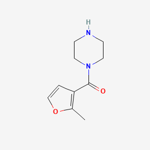 molecular formula C10H14N2O2 B13203813 1-(2-Methylfuran-3-carbonyl)piperazine 