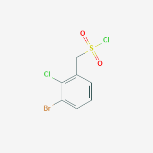 molecular formula C7H5BrCl2O2S B13214642 (3-Bromo-2-chlorophenyl)methanesulfonyl chloride 