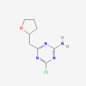 molecular formula C8H11ClN4O B13216377 4-Chloro-6-(oxolan-2-ylmethyl)-1,3,5-triazin-2-amine 