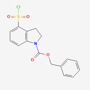 molecular formula C16H14ClNO4S B13217305 Benzyl 4-(chlorosulfonyl)-2,3-dihydro-1H-indole-1-carboxylate 