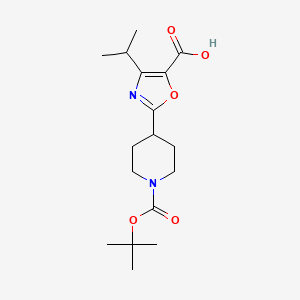 molecular formula C17H26N2O5 B13235347 2-{1-[(Tert-butoxy)carbonyl]piperidin-4-yl}-4-(propan-2-yl)-1,3-oxazole-5-carboxylic acid 