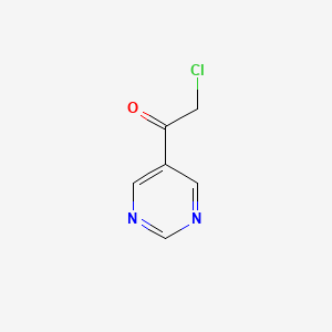 molecular formula C6H5ClN2O B13246064 2-Chloro-1-(pyrimidin-5-yl)ethan-1-one 