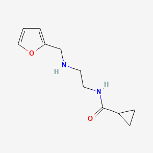 molecular formula C11H16N2O2 B13255671 N-{2-[(furan-2-ylmethyl)amino]ethyl}cyclopropanecarboxamide 