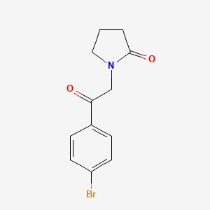 molecular formula C12H12BrNO2 B13256498 1-[2-(4-Bromophenyl)-2-oxoethyl]pyrrolidin-2-one 