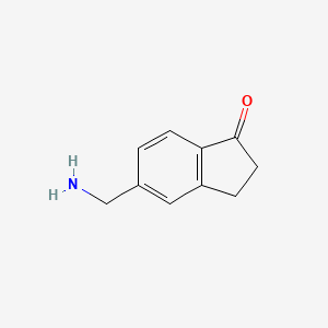 molecular formula C10H11NO B13259464 5-(Aminomethyl)-2,3-dihydro-1H-inden-1-one 