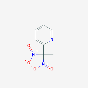 molecular formula C7H7N3O4 B132640 2-(1,1-Dinitroethyl)pyridine CAS No. 145964-17-6