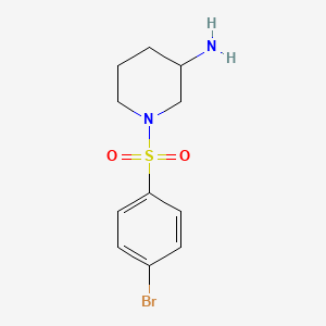 molecular formula C11H15BrN2O2S B13265899 1-(4-Bromobenzenesulfonyl)piperidin-3-amine 