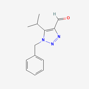 molecular formula C13H15N3O B13268444 1-Benzyl-5-(propan-2-yl)-1H-1,2,3-triazole-4-carbaldehyde 