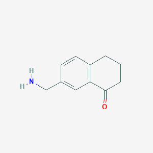 molecular formula C11H13NO B13269048 7-(Aminomethyl)-1,2,3,4-tetrahydronaphthalen-1-one 