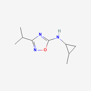 molecular formula C9H15N3O B13272534 N-(2-Methylcyclopropyl)-3-(propan-2-yl)-1,2,4-oxadiazol-5-amine 