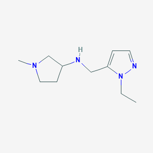 molecular formula C11H20N4 B13283271 N-[(1-Ethyl-1H-pyrazol-5-yl)methyl]-1-methylpyrrolidin-3-amine 