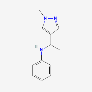 molecular formula C12H15N3 B13289971 N-[1-(1-Methyl-1H-pyrazol-4-yl)ethyl]aniline 