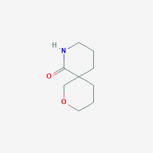 molecular formula C9H15NO2 B13292449 2-Oxa-8-azaspiro[5.5]undecan-7-one 