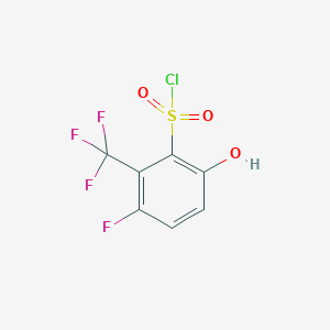 molecular formula C7H3ClF4O3S B13292494 3-Fluoro-6-hydroxy-2-(trifluoromethyl)benzene-1-sulfonyl chloride 