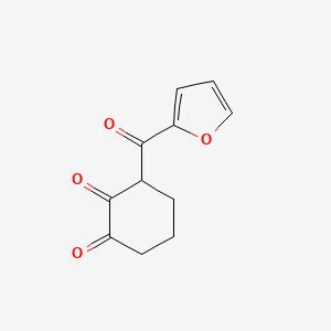 molecular formula C11H10O4 B13293010 3-(Furan-2-carbonyl)cyclohexane-1,2-dione 
