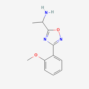 molecular formula C11H13N3O2 B13293255 1-[3-(2-Methoxyphenyl)-1,2,4-oxadiazol-5-yl]ethan-1-amine 