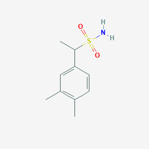 molecular formula C10H15NO2S B13293359 1-(3,4-Dimethylphenyl)ethane-1-sulfonamide 
