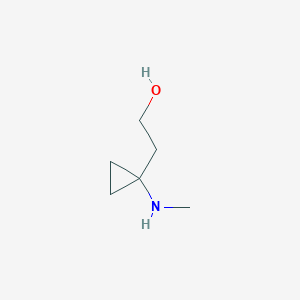 molecular formula C6H13NO B13293856 2-[1-(Methylamino)cyclopropyl]ethan-1-ol 
