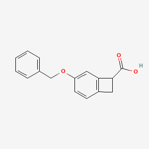 molecular formula C16H14O3 B13334630 4-(Benzyloxy)bicyclo[4.2.0]octa-1,3,5-triene-7-carboxylic acid 