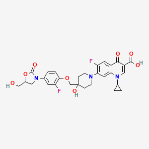 molecular formula C29H29F2N3O8 B13385340 1-Cyclopropyl-6-fluoro-7-[4-[2-fluoro-4-[5(R)-(hydroxymethyl)-2-oxooxazolidin-3-yl]phenoxymethyl]-4-hydroxypiperidin-1-yl]-4-oxo-1,4-dihydroquinoline-3-carboxylic acid;1-Cyclopropyl-6-fluoro-7-[4-[2-fluoro-4-[5(R)-(hydroxymethyl)-2-oxooxazolidin-3-yl]phenoxymethyl]-4-hydroxypiperidin-1-yl]-4-oxo-1,4-dihydroquinoline-3-carboxylic acid 