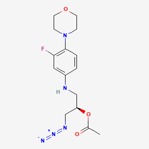 molecular formula C15H20FN5O3 B13431741 (2R)-1-Azido-3-[[3-fluoro-4-(4-morpholinyl)phenyl]amino]-2-propanol 2-Acetate 