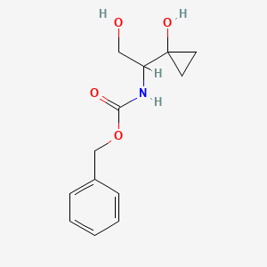 molecular formula C13H17NO4 B13459398 benzyl N-[2-hydroxy-1-(1-hydroxycyclopropyl)ethyl]carbamate 
