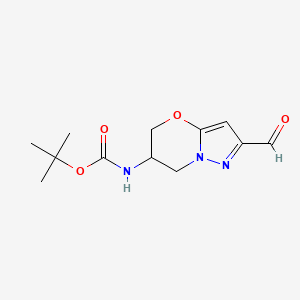 molecular formula C12H17N3O4 B13460108 tert-butyl N-{2-formyl-5H,6H,7H-pyrazolo[3,2-b][1,3]oxazin-6-yl}carbamate 