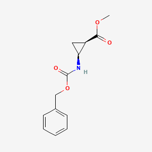 molecular formula C13H15NO4 B13463596 rac-methyl (1R,2S)-2-{[(benzyloxy)carbonyl]amino}cyclopropane-1-carboxylate 