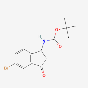 molecular formula C14H16BrNO3 B13465660 Tert-butyl (5-bromo-3-oxo-2,3-dihydro-1H-inden-1-YL)carbamate 