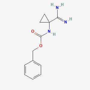 molecular formula C12H15N3O2 B13483550 Benzyl (1-carbamimidoylcyclopropyl)carbamate 