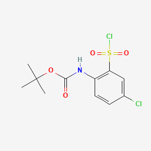 molecular formula C11H13Cl2NO4S B13484702 tert-Butyl (4-chloro-2-(chlorosulfonyl)phenyl)carbamate 