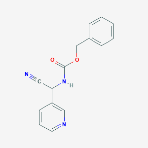 molecular formula C15H13N3O2 B13513648 Benzyl (cyano(pyridin-3-yl)methyl)carbamate 