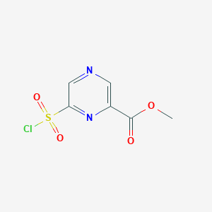molecular formula C6H5ClN2O4S B13569554 Methyl 6-(chlorosulfonyl)pyrazine-2-carboxylate 