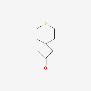 molecular formula C8H12OS B13572436 7-Thiaspiro[3.5]nonan-2-one 