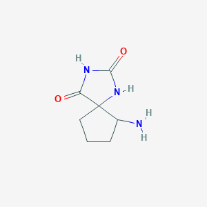 molecular formula C7H11N3O2 B13584742 6-Amino-1,3-diazaspiro[4.4]nonane-2,4-dione 