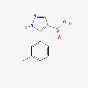 molecular formula C12H12N2O2 B13606112 3-(3,4-Dimethylphenyl)-1H-pyrazole-4-carboxylic acid CAS No. 879996-76-6