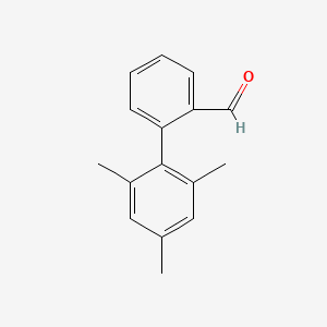 molecular formula C16H16O B13619484 2',4',6'-Trimethyl-[1,1'-biphenyl]-2-carbaldehyde 