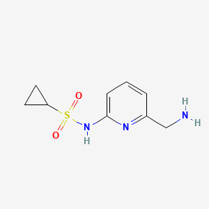 molecular formula C9H13N3O2S B13622117 N-[6-(Aminomethyl)-2-pyridinyl]cyclopropanesulfonamide 
