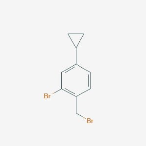 molecular formula C10H10Br2 B13672543 2-Bromo-1-(bromomethyl)-4-cyclopropylbenzene 