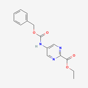 molecular formula C15H15N3O4 B13673318 Ethyl 5-(((benzyloxy)carbonyl)amino)pyrimidine-2-carboxylate 