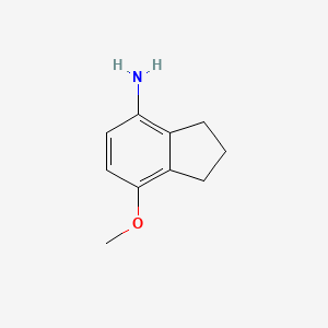 molecular formula C10H13NO B13675006 7-Methoxy-2,3-dihydro-1H-inden-4-amine 