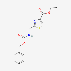 molecular formula C15H16N2O4S B13678392 Ethyl 2-[(Cbz-amino)methyl]thiazole-4-carboxylate 