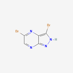 molecular formula C5H2Br2N4 B13678619 3,5-Dibromo-1H-pyrazolo[3,4-b]pyrazine 