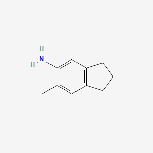 molecular formula C10H13N B13682221 5-Amino-6-methylindane 